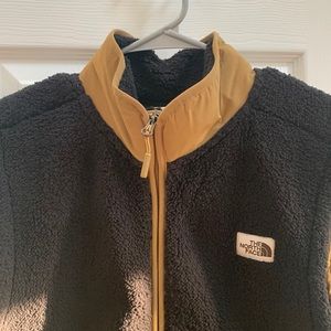 Brands new with tags North face  mens vest.  Black with tan trim
